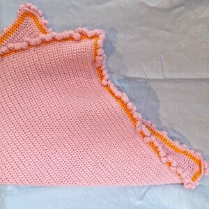 Handmade pink crochet baby blanket